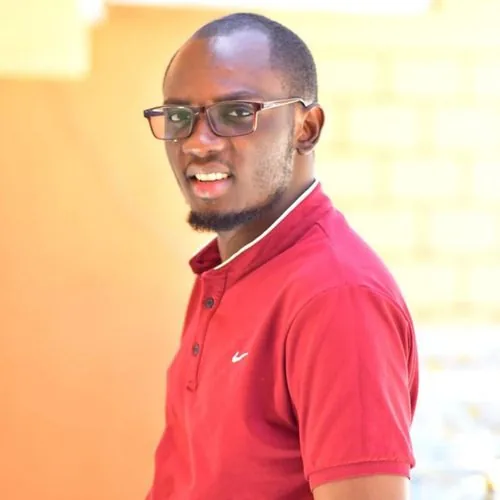Portrait of Mr. Fredrick Omollo Okello, Co-Founder and Director of Partnerships at Tree Niches